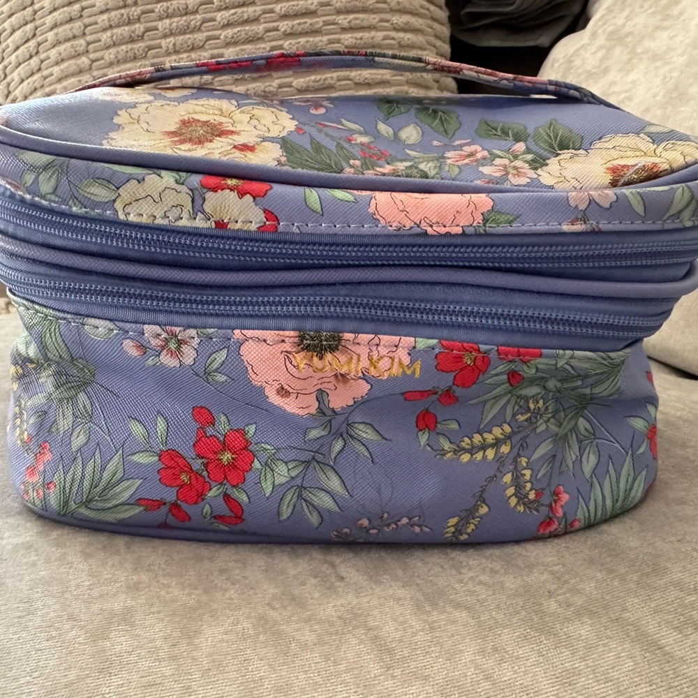 Yumi Kim Blue/Red Cosmetic Bag, Floral Design filled with travel Size products